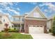 Charming two-story home with a brick-and-siding facade, well-manicured lawn, and a two-car garage at 2728 Cameron Pond Dr, Cary, NC 27519