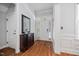 Elegant foyer with hardwood flooring, a decorative mirror, and a bright, welcoming atmosphere at 2728 Cameron Pond Dr, Cary, NC 27519