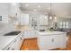 Bright and airy kitchen featuring an island with seating and stainless steel appliances at 2728 Cameron Pond Dr, Cary, NC 27519
