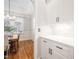 Charming view of dining room from a bright butler's pantry with white cabinets and light countertops at 2728 Cameron Pond Dr, Cary, NC 27519
