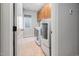 Convenient laundry room featuring a washer and dryer set, cabinetry, and tile flooring at 2728 Cameron Pond Dr, Cary, NC 27519
