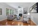 Bright living room with hardwood floors, fireplace, built-in shelving and comfortable seating at 2728 Cameron Pond Dr, Cary, NC 27519