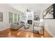 Bright living room with fireplace, built-in shelving, and large windows for abundant natural light at 2728 Cameron Pond Dr, Cary, NC 27519