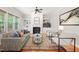 Bright living room features a fireplace, built-in shelves, and two chairs facing a comfortable sofa at 2728 Cameron Pond Dr, Cary, NC 27519