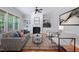 Cozy living room featuring a fireplace, built-in shelves, and hardwood floors at 2728 Cameron Pond Dr, Cary, NC 27519