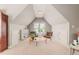 Lofted living room with vaulted ceilings, two chairs, and a large window at 2728 Cameron Pond Dr, Cary, NC 27519