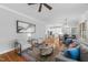 Open living space with hardwood floors, connects living, dining, and kitchen areas for seamless entertaining at 2728 Cameron Pond Dr, Cary, NC 27519