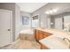 The main bathroom features a vanity with dual sinks and a soaking tub at 2728 Cameron Pond Dr, Cary, NC 27519