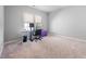Bright office space with a large window and neutral walls at 2728 Cameron Pond Dr, Cary, NC 27519