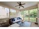 Relax on this screened-in porch with outdoor seating, a ceiling fan, and views of the backyard at 2728 Cameron Pond Dr, Cary, NC 27519
