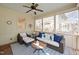 This sunroom features wicker seating, a ceiling fan, and roll down shades at 2728 Cameron Pond Dr, Cary, NC 27519