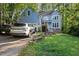 Beautiful two-story home with light blue siding, front yard and an attached two-car garage at 307 Durington Pl, Cary, NC 27518