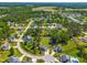 An aerial view of a well-planned community surrounded by mature trees and lush landscaping at 311 Ocean Dr, Clayton, NC 27520