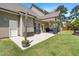 Back patio with outdoor seating, string lights, and grill, perfect for entertaining at 311 Ocean Dr, Clayton, NC 27520