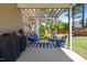 Inviting back patio featuring comfortable seating, a pergola, and a grill at 311 Ocean Dr, Clayton, NC 27520
