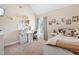 This bedroom features a white bed frame, an office area with a desk and chair at 311 Ocean Dr, Clayton, NC 27520