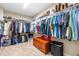 This walk-in closet is filled with plenty of storage space, shelving, and clothes racks at 311 Ocean Dr, Clayton, NC 27520