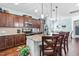 Stylish kitchen with stainless steel appliances, granite countertops, and breakfast bar seating at 311 Ocean Dr, Clayton, NC 27520