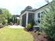 This backyard includes a screened porch, chairs, and nice landscaping at 3521 Olive Glen Dr, Apex, NC 27502
