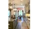 Spacious kitchen featuring a large island, stainless steel appliances, and hardwood floors at 3521 Olive Glen Dr, Apex, NC 27502