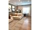 Large, open-concept living room with modern furniture, stylish decor, and ample natural light at 3521 Olive Glen Dr, Apex, NC 27502