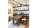 Bright office with a large wooden desk, decorative shelves, and many framed photos at 3521 Olive Glen Dr, Apex, NC 27502