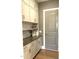 Walk-in pantry with ample storage space, sleek countertop, and gold hardware at 3521 Olive Glen Dr, Apex, NC 27502