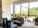 This screened porch has chairs to relax in while overlooking a nice view of the backyard at 3521 Olive Glen Dr, Apex, NC 27502