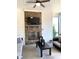 This screened porch has a fireplace, ceiling fan, and places to sit and relax at 3521 Olive Glen Dr, Apex, NC 27502
