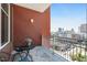 Balcony featuring a cozy seating area with city views and brick facade at 400 W North St # 1134, Raleigh, NC 27603