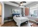 Bedroom with large window and hardwood flooring featuring neutral color palette at 400 W North St # 1134, Raleigh, NC 27603