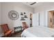 Bedroom featuring hardwood flooring, neutral color palette, and access to the ensuite bathroom at 400 W North St # 1134, Raleigh, NC 27603