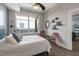 Bedroom with large window showing city views featuring hardwood flooring and neutral color palette at 400 W North St # 1134, Raleigh, NC 27603