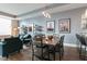 Elegant dining area with a wooden table set for six, blending seamlessly with the adjacent modern living area at 400 W North St # 1134, Raleigh, NC 27603