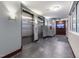 Hallway with modern elevators and a decorative television display on the wall at 400 W North St # 1134, Raleigh, NC 27603