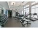 Bright fitness center featuring modern equipment, weight machines, and floor-to-ceiling windows at 400 W North St # 1134, Raleigh, NC 27603
