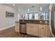 Kitchen featuring granite countertops, stainless steel appliances and view into the living room at 400 W North St # 1134, Raleigh, NC 27603