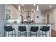 Stylish kitchen bar area featuring granite countertops and pendant lighting, perfect for casual dining at 400 W North St # 1134, Raleigh, NC 27603