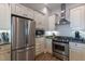 Modern kitchen featuring stainless steel appliances, granite countertops and custom white cabinets at 400 W North St # 1134, Raleigh, NC 27603