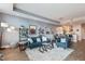 Stylish living area blending a modern sofa and shelves with an open view of the dining and kitchen spaces at 400 W North St # 1134, Raleigh, NC 27603