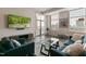 Comfortable living room with a contemporary design, filled with natural light from the large windows and a balcony at 400 W North St # 1134, Raleigh, NC 27603