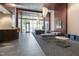 Inviting lobby area with elegant seating, artwork, and access to the outside at 400 W North St # 1134, Raleigh, NC 27603