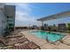 Rooftop pool with city views, lounge chairs, and a pergola at 400 W North St # 1134, Raleigh, NC 27603