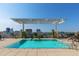 Rooftop pool and sundeck with lounge seating and scenic skyline view at 400 W North St # 1134, Raleigh, NC 27603