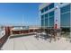 Rooftop deck featuring outdoor seating, barbecue grills, and scenic views at 400 W North St # 1134, Raleigh, NC 27603