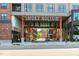 Street view showcasing the Smoky Hollow entrance with buildings and pedestrian access at 400 W North St # 1134, Raleigh, NC 27603