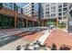 Street view of property showing commercial storefronts and brick-paved sidewalk at 400 W North St # 1134, Raleigh, NC 27603