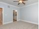 This bedroom has neutral carpet and an ensuite bathroom at 412 Waterford Lake Dr, Cary, NC 27519