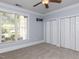 Light blue bedroom with neutral carpet, white trim, exterior view and double closets at 412 Waterford Lake Dr, Cary, NC 27519