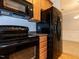 This kitchen showcases wooden cabinetry, granite countertops, and stainless steel appliances at 412 Waterford Lake Dr, Cary, NC 27519